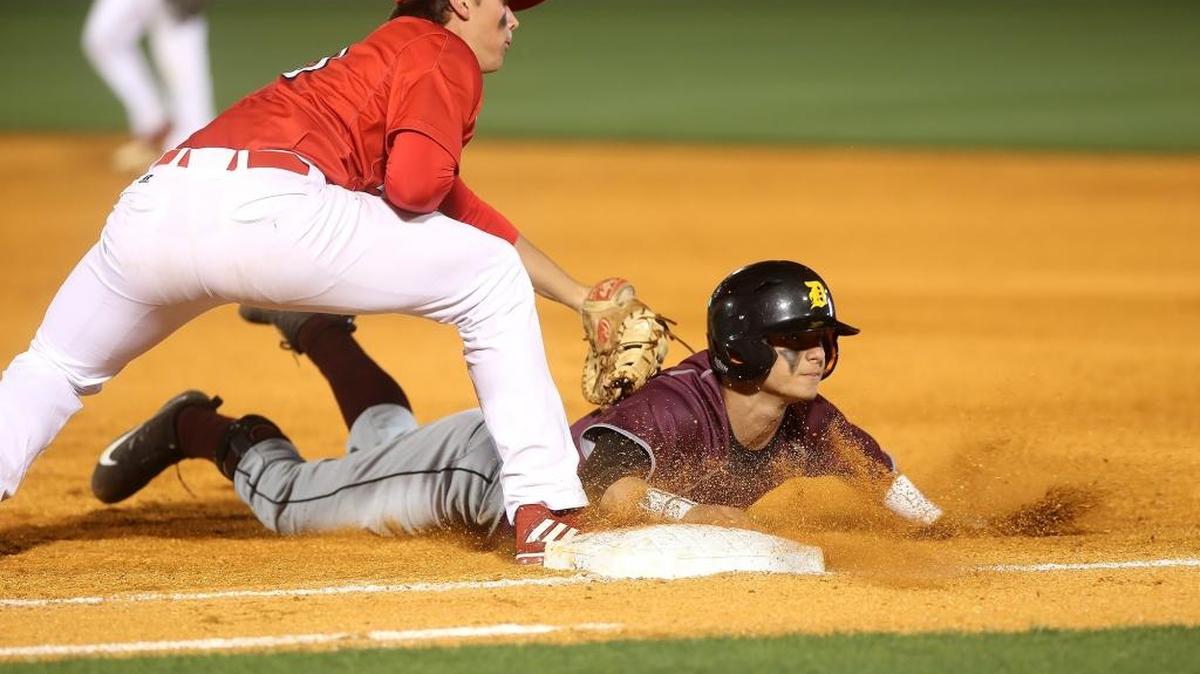 D’Iberville’s Eric Thacker is picked off at first base by Biloxi’s Jordan O’Keefe at MGM Park in Biloxi on March 3. BHS and DHS are participating in this week’s Battle at the Beach baseball tournament, which will have games at Biloxi, D’Iberville, Ocean Springs, Gulfport, St. Martin and MGM Park.