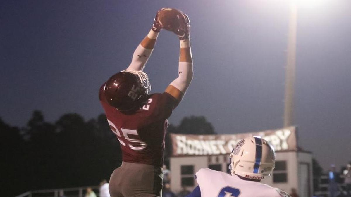 East Central wide receiver Brad Cumbest makes the catch in the end zone for a touchdown while being guarded by Jefferson Davis County's Ronald Baker on Friday at East Central High School in Hurley.