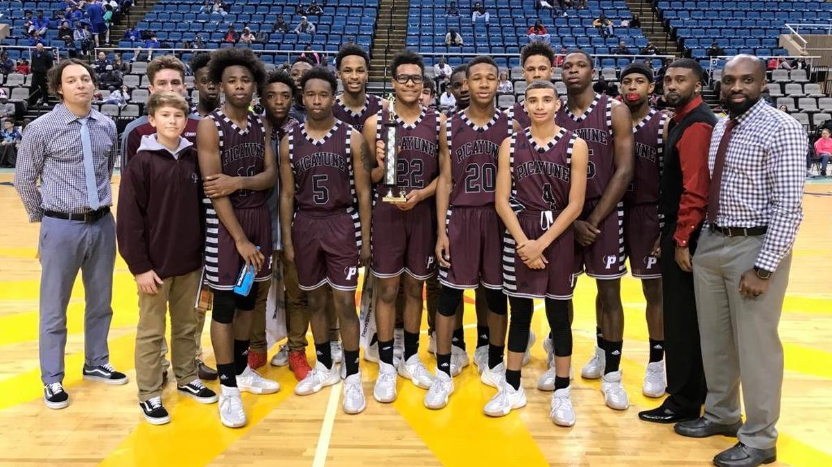 Picayune celebrates beating St. Martin 38-25 in the third game of Saturday’s Hoopsfest festivities at the Mississippi Coast Coliseum.