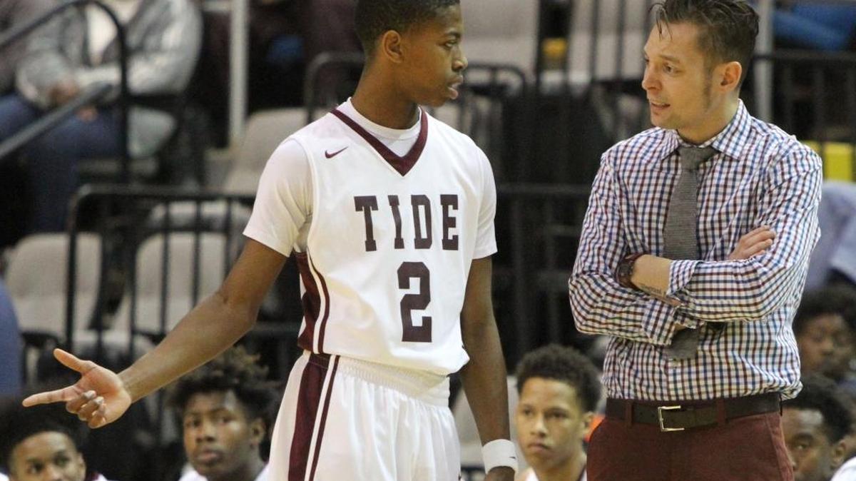Picayune head coach Kelton Thompson talks to Marvin Arnold.