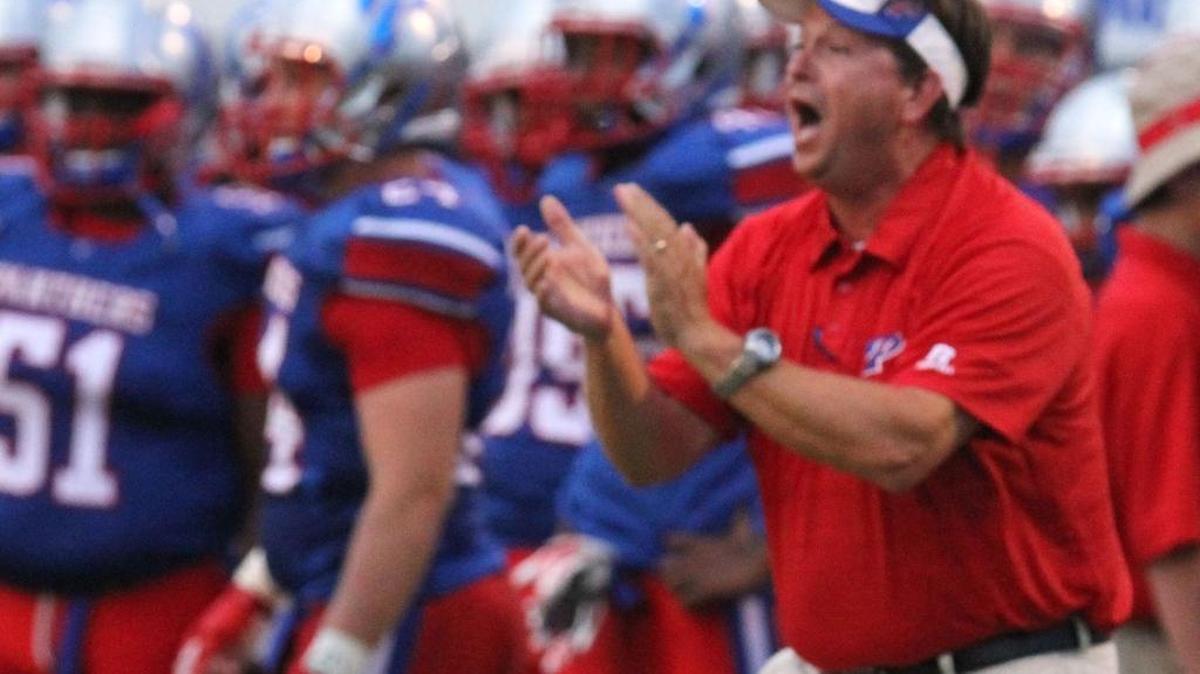 Pascagoula coach Lewis Sims cheers on his players during the first quarter of their game against Moss Point at War Memorial Stadium in Pascagoula on Aug. 19, 2016.