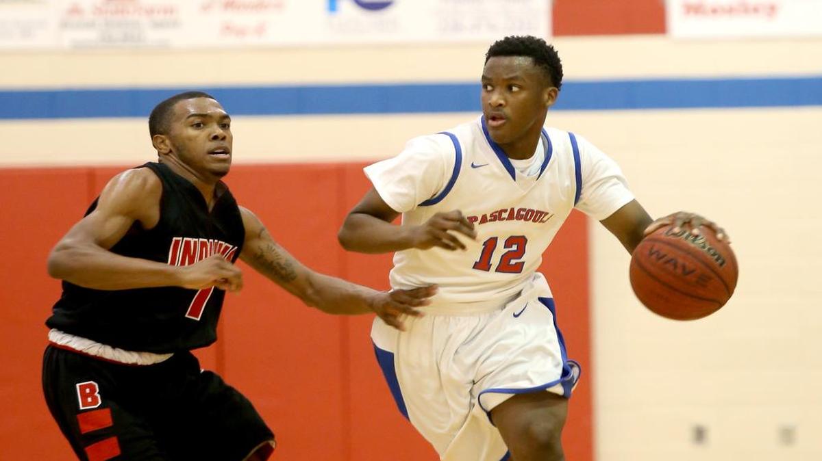 Pascagoula's Dequon Weatherspoon is guarded by Biloxi's Ahmad Arrington. The Panthers held off Gautier on Friday night.