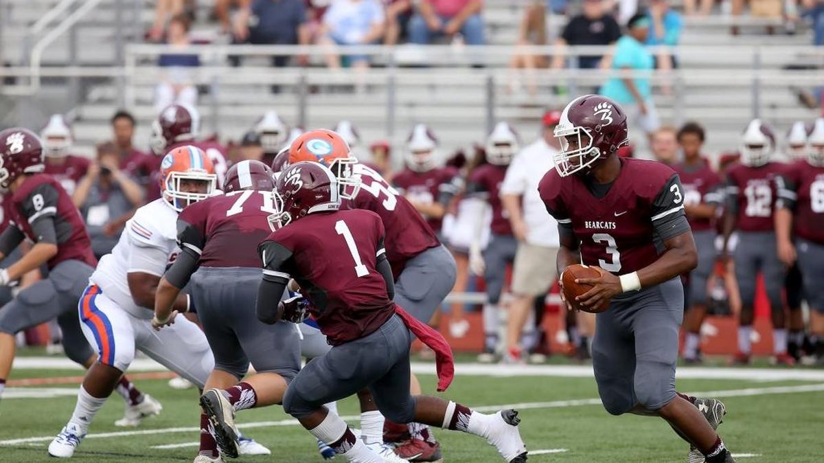 Long Beach quarterback Jaidon Evans looks for an open man while competing against Long Beach during the 2016 Shrimp Bowl on August 19, 2016, in Biloxi.
