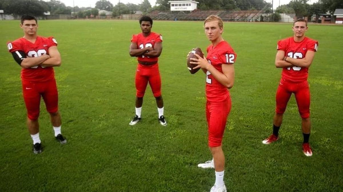 St. Stanislaus quarterback Myles Brennan stands with his offensive play makers Chase Rogers, left, Darius Pittman, center, and Corbin Blanchard. SSC played at Brother Martin (La.) on Friday.