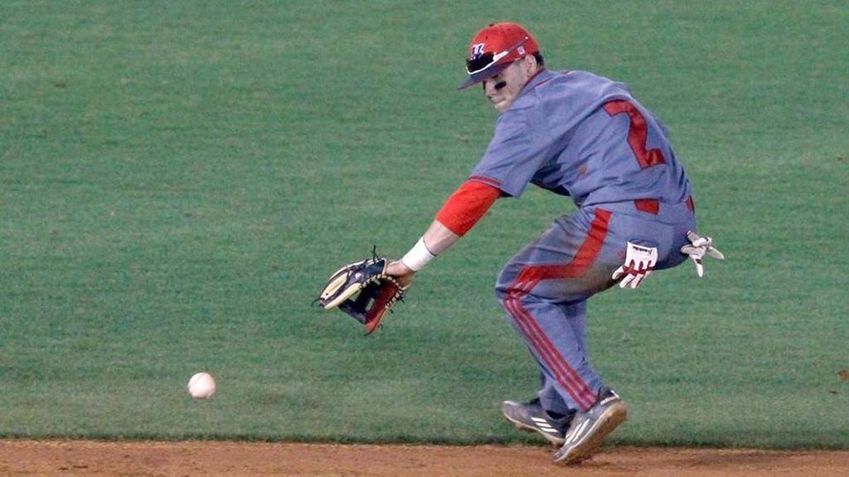 Hancock shortstop Landon Jordan fields a ground ball against Harrison Central, Thursday, March 31, 2016.