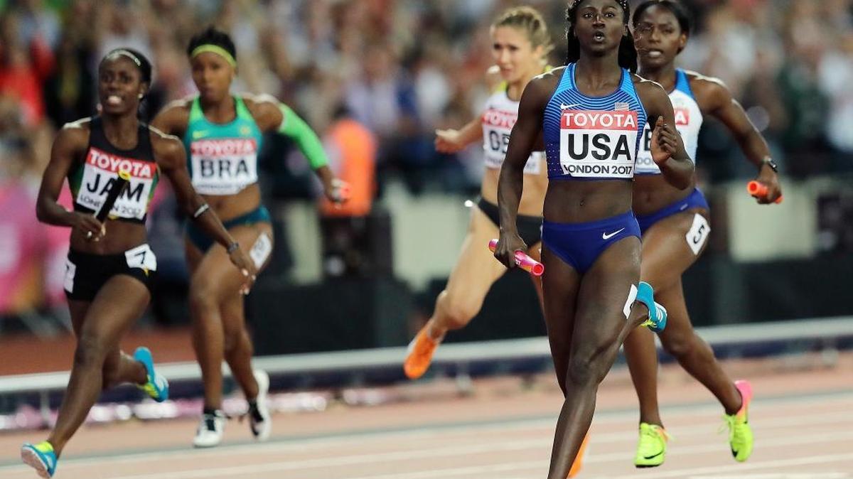 Tori Bowie, right, crosses the line to win the gold in the women's 4x100-meter relay final during the World Athletics Championships in London Saturday.