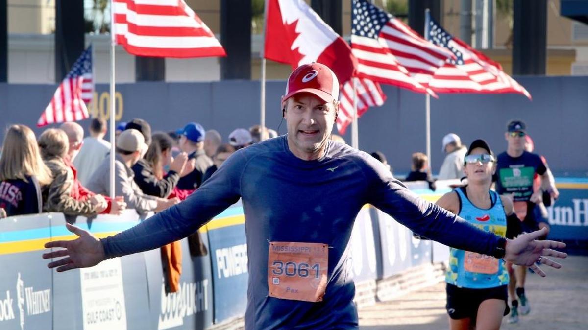 Pax Mogenson crosses the finish line at MGM Park during the 2016 Mississippi Gulf Coast Marathon. Events for this year’s Marathon gets underway Friday.