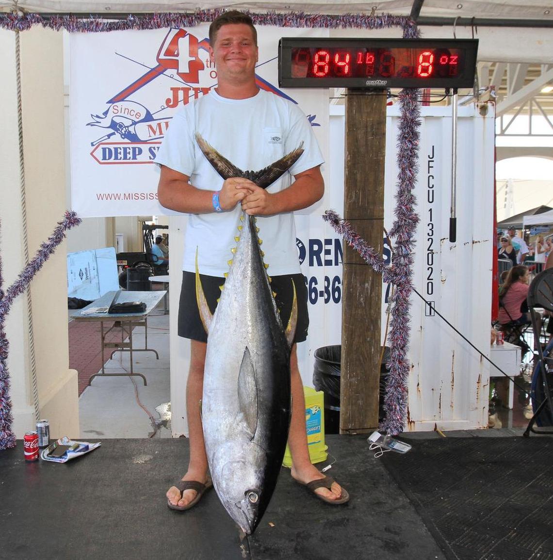 Logan Terwilliger of Gulfport holds his first-place tuna weighing 84-pounds, 8-ounces at the Mississippi Deep Sea Fishing Rodeo at Barksdale Pavilion in Gulfport on Tuesday, July 4, 2017.