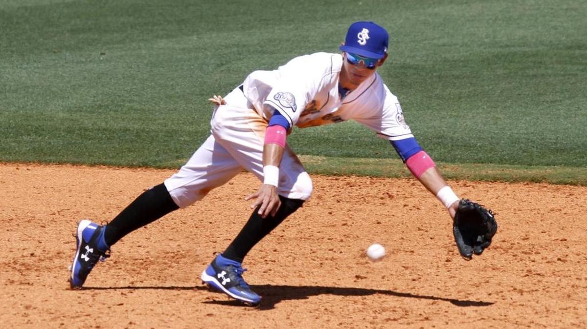 Shuckers shortstop Mauricio Dubon ranges to his left to make a diving stop of a ground ball during game between the Shuckers and Braves.