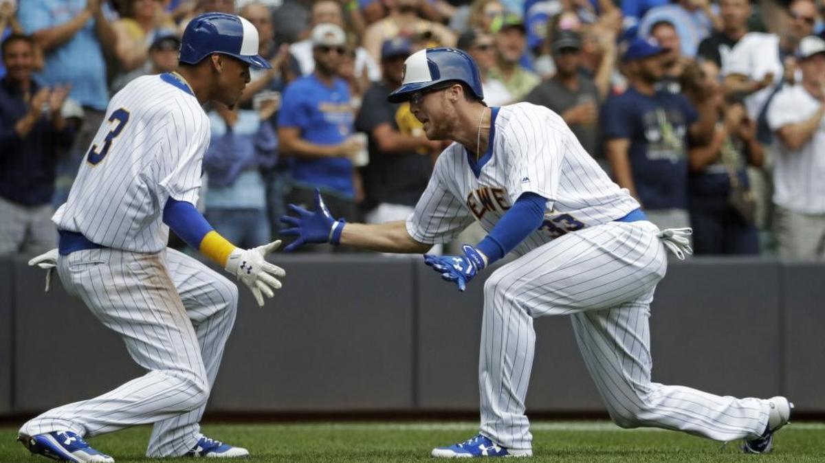 Milwaukee Brewers outfielder Brett Phillips celebrates his two-run home run with teammate Orlando Arcia during the fifth inning of a game against the Philadelphia Phillies on July 16 in Milwaukee. Phillips and Arcia are former Biloxi Shuckers.