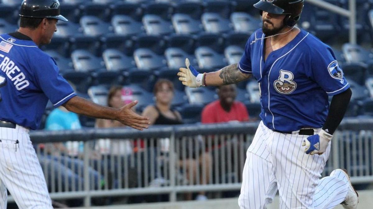 Biloxi Manager Mike Guerrero greets first baseman Nick Ramirez after he hit a two-run homer during the first inning of their Southern League game against Mobile at MGM Park in Biloxi on Thursday, Aug. 17, 2016.