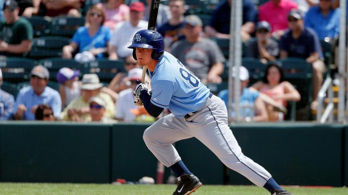 Tampa Bay Rays' Braxton Lee follows through on a swing against the Minnesota Twins in a spring training baseball game on March 23, 2016, in Fort Myers, Fla.