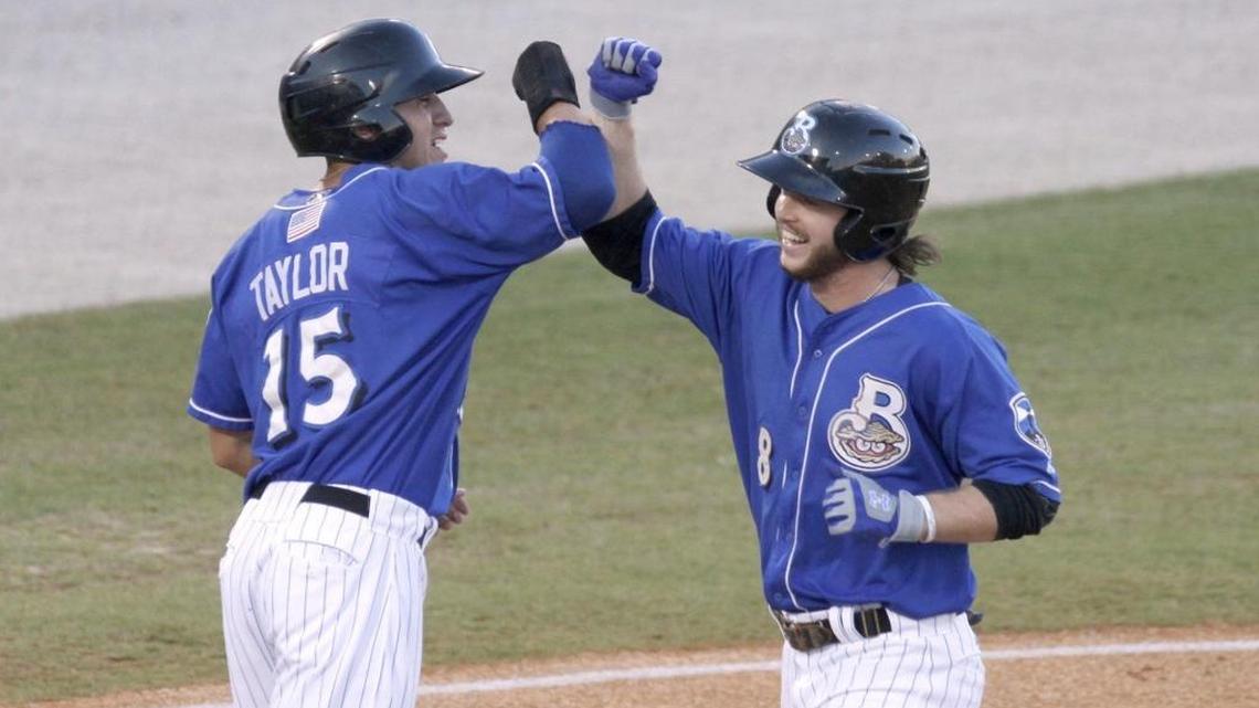 Brett Phillips and Tyrone Taylor of the Biloxi Shuckers celebrate a two-run home run by Phillips in the first inning against Jackson Generals on Wednesday.