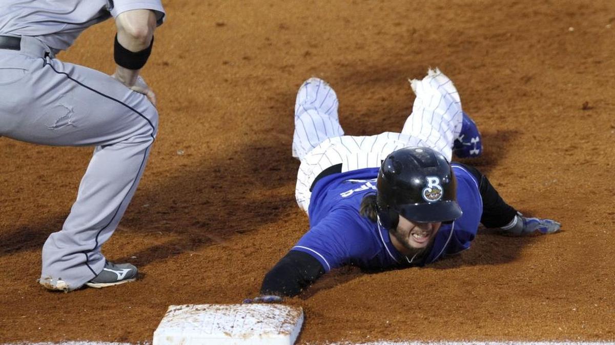 Brett Phillips of the Biloxi Shuckers dives safely back to first against Jackson Generals on Aug. 31.