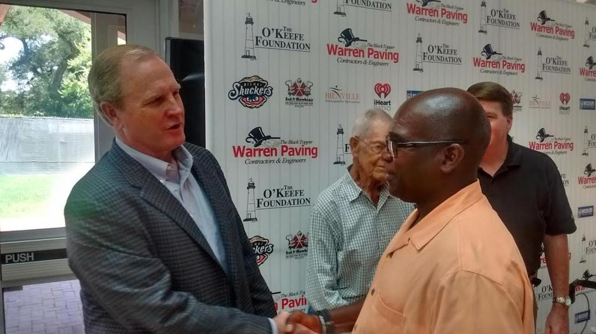 Former Baylor coach Steve Smith speaks with Biloxi umpire Terrence Mobley. Smith spoke at the Ohr-O'Keefe Museum of Arts Our Love Affair with Baseball weekly noon luncheon Friday.