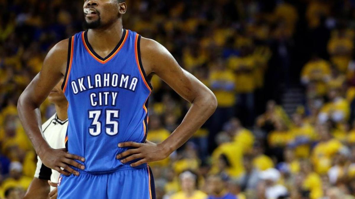 FILE - In this May 26, 2016, file photo, Oklahoma City Thunder's Kevin Durant watches during the closing minutes of the second half in Game 5 of the NBA basketball Western Conference finals against the Golden State Warriors in Oakland, Calif. Durant and others are ready to decide their NBA futures, with free agency beginning Friday, July 1, 2016. Teams have more cap room than ever, meaning this could be one of the more highly anticipated periods in league history.