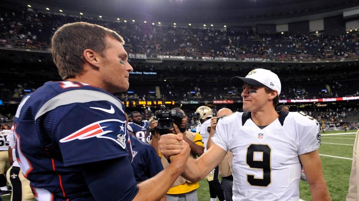 New England Patriots quarterback Tom Brady, left, greets New Orleans Saints quarterback Drew Brees (9). The Patriots and the Saints meet Sunday in New Orleans.
