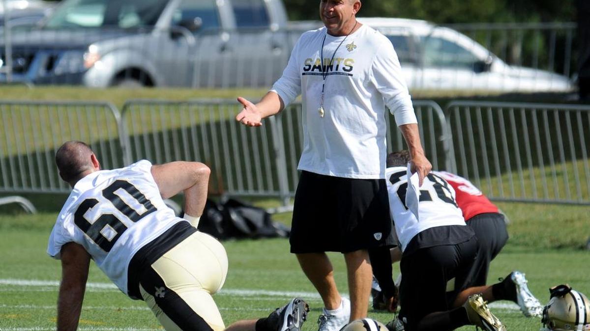 New Orleans Saints center Max Unger (60) talks with head coach Sean Payton during the NFL football teams training camp in White Sulphur Springs, W.Va. last year. The Saints will have training camp in Metairie this summer.
