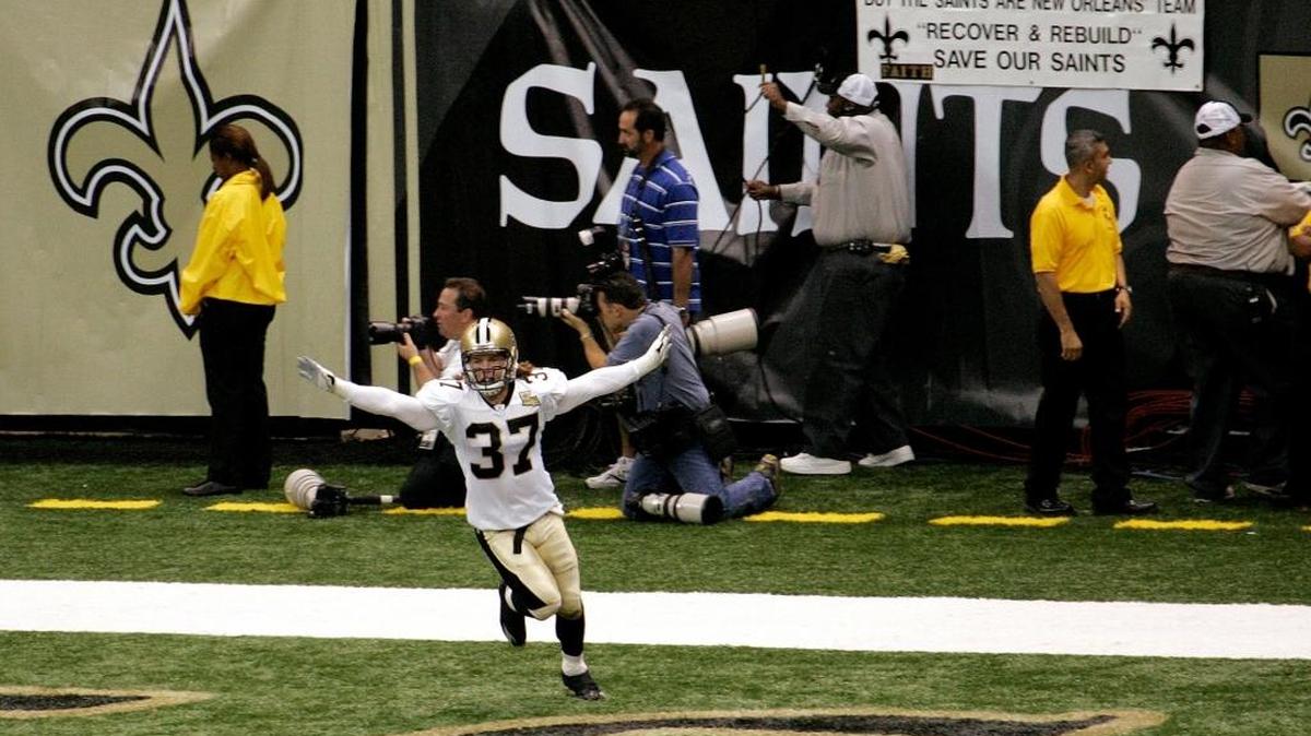 In this file photo taken Sept. 25, 2006, New Orleans Saints' Steve Gleason (37) sprints through the end zone after blocking an Atlanta Falcons punt in the first quarter of their NFL football game at the newly reopened Louisiana Superdome after Hurricane Katrina in New Orleans. The Saints recovered for a touchdown.