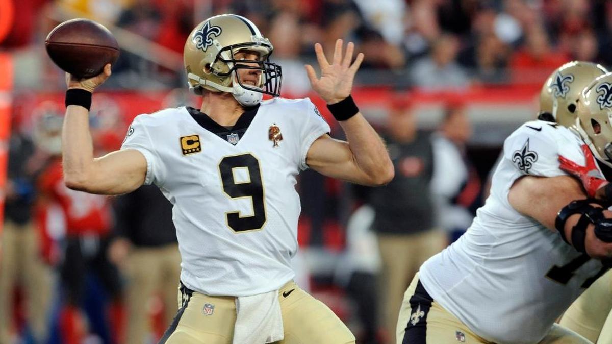 In this Sunday, Dec. 31, 2017, file photo, New Orleans Saints quarterback Drew Brees (9) throws a pass against the Tampa Bay Buccaneers during the first half of an NFL football game in Tampa, Fla. Although Brees passed for his fewest yards (4,334) since joining the Saints in 2006, he was as efficient as ever, setting a single-season record with his 72 percent completion rate.