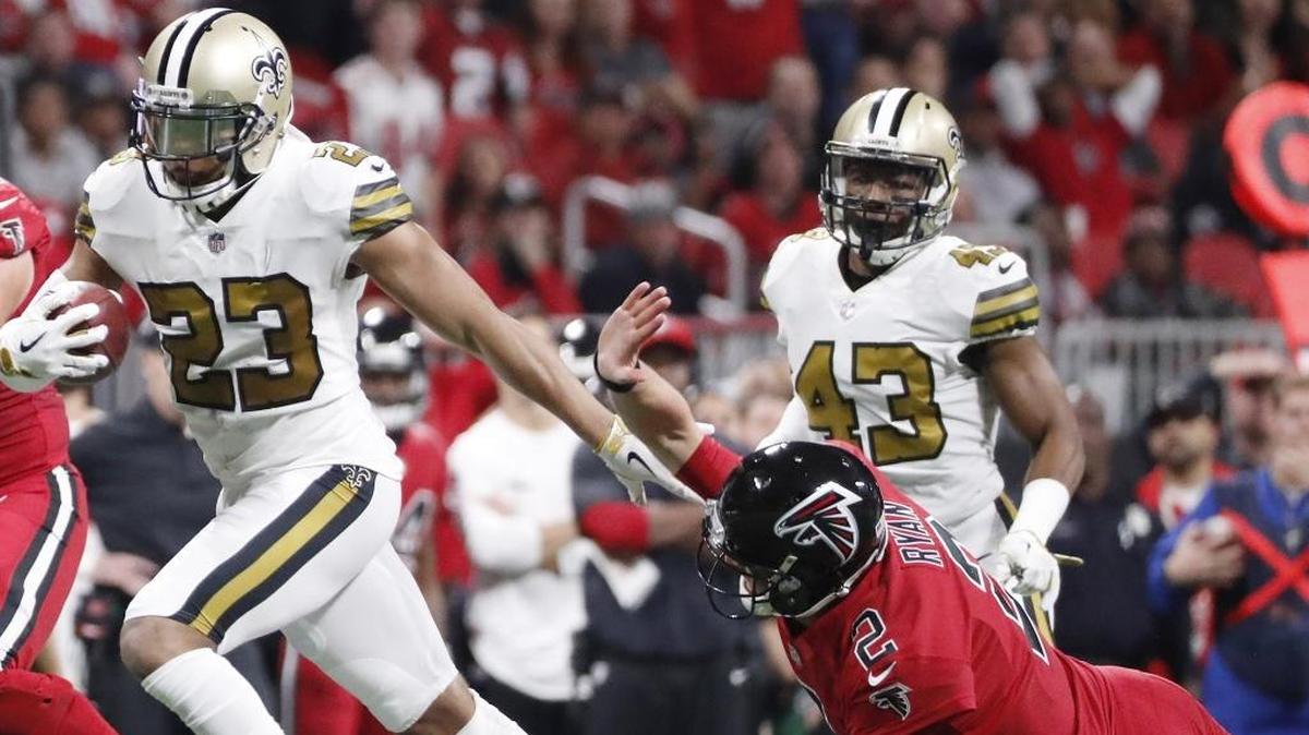 New Orleans Saints cornerback Marshon Lattimore (23) runs back an interception as Atlanta Falcons quarterback Matt Ryan (2) tries to make the tackle, Thursday, Dec. 7, 2017, in Atlanta.