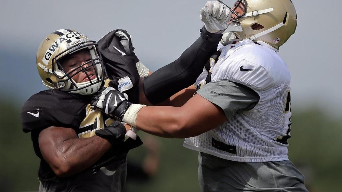New Orleans Saints defensive end Obum Gwacham (58) and Saints offensive guard Andrus Peat (75) drill 2017 training camp in White Sulphur Springs, W.Va., Aug. 1, 2016.