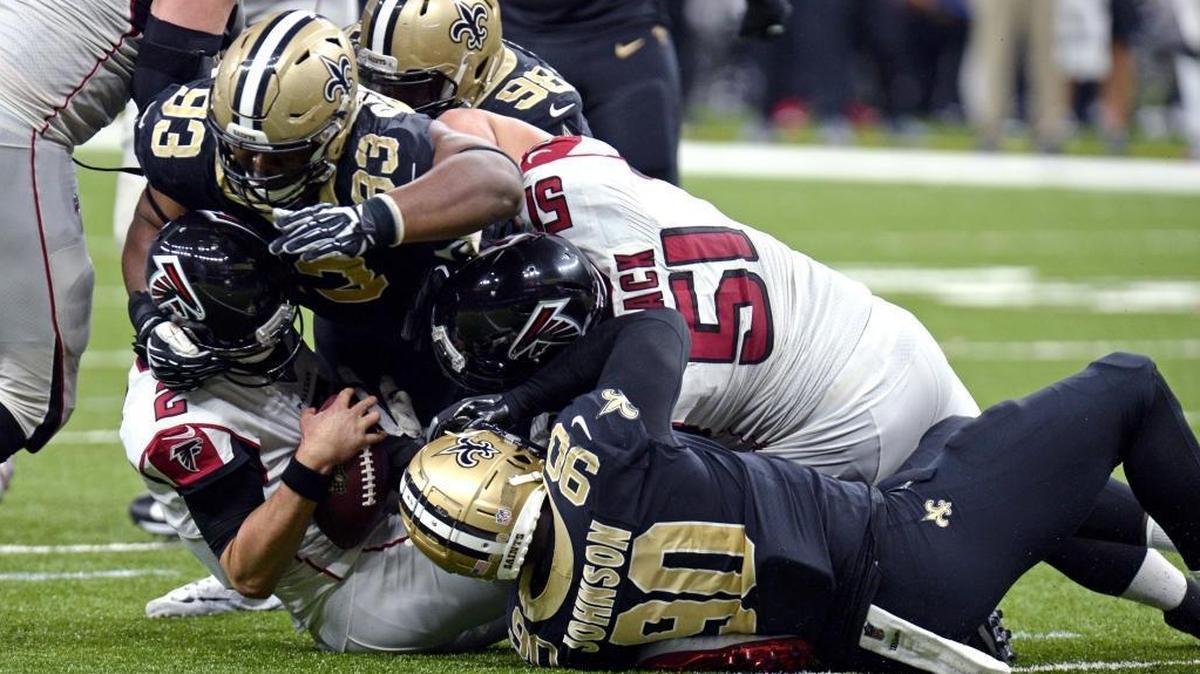 Atlanta Falcons quarterback Matt Ryan (2) is sacked by New Orleans Saints defensive tackle David Onyemata (93), defensive end George Johnson (90) and defensive tackle Sheldon Rankins (98) in the second half of an NFL football game in New Orleans, Sunday, Dec. 24, 2017.