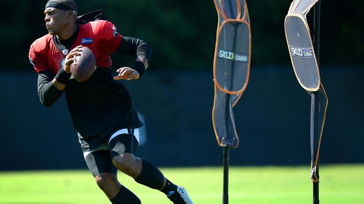 Carolina Panthers quarterback Cam Newton rushes out of the pocket during training camp Sunday, July 31, 2016, in Spartanburg, SC.