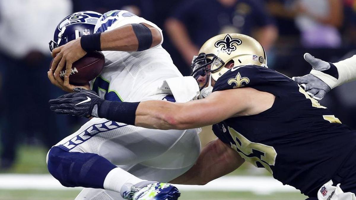 New Orleans Saints defensive end Paul Kruger sacks Seattle Seahawks quarterback Russell Wilson.