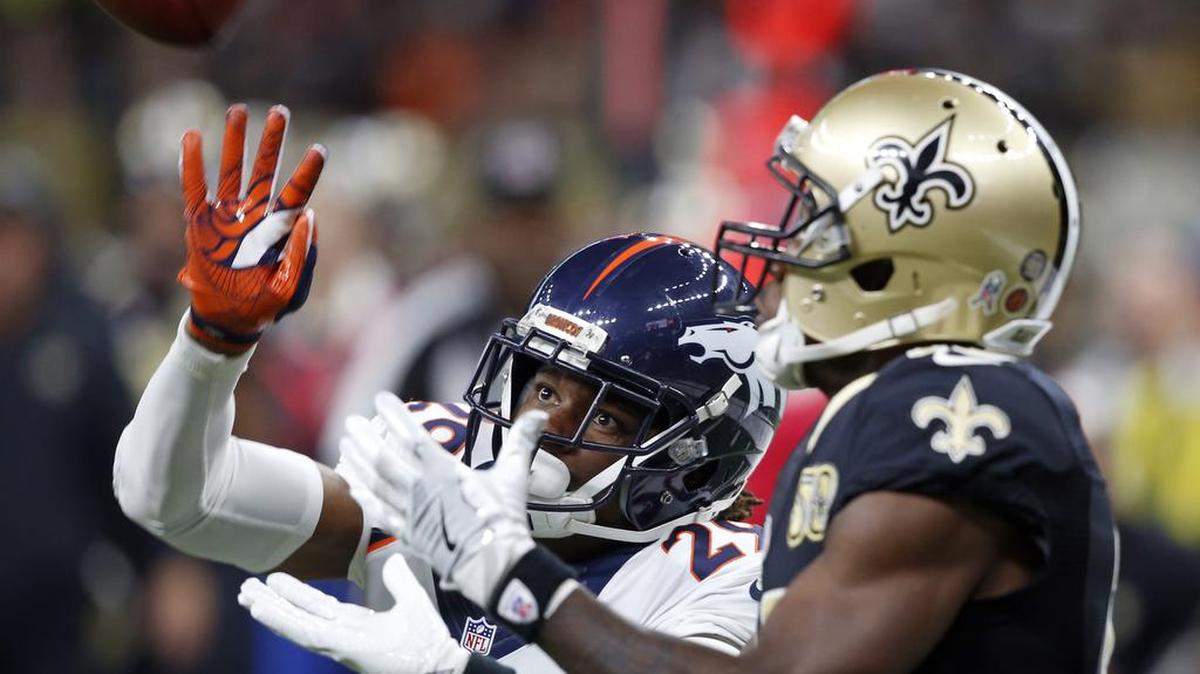 New Orleans Saints wide receiver Brandin Cooks (10) pulls in a 37 yard pass as Denver Broncos cornerback Bradley Roby (29) covers.