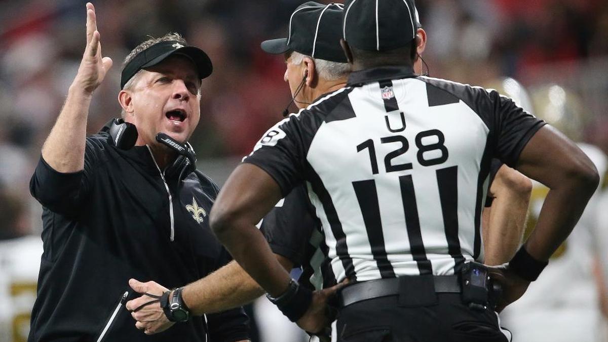 New Orleans Saints head coach Sean Payton speaks to umpire Ramon George during the second half of an NFL football game against the Atlanta Falcons, Thursday, Dec. 7, 2017, in Atlanta.