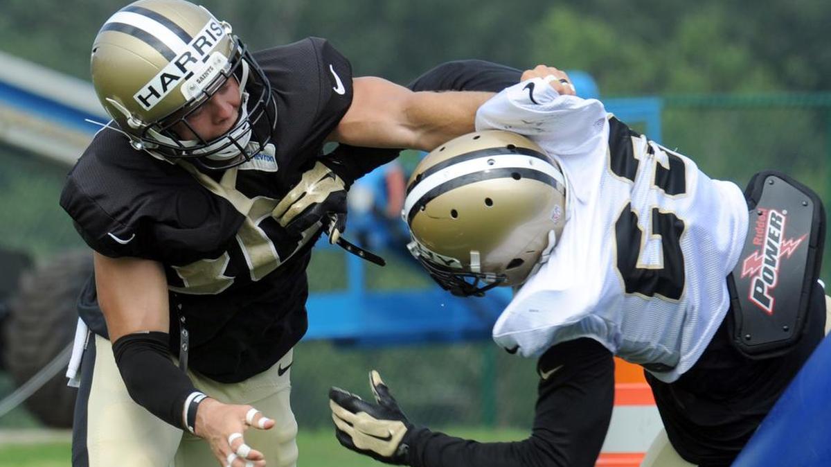New Orleans Saints defensive back Erik Harris (30) in a blocking drill with a teammate during the NFL football teams training camp in White Sulphur Springs, W.Va., Friday.