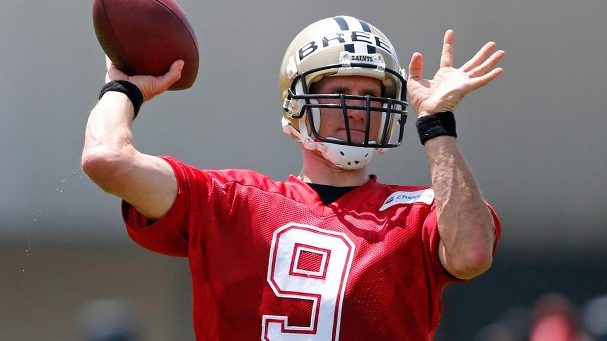 New Orleans Saints quarterback Drew Brees (9) takes part in a drill during the NFL football team's minicamp in Metairie, La. The Saints open training camp in White Sulphur Springs, West Virginia, on July 27.