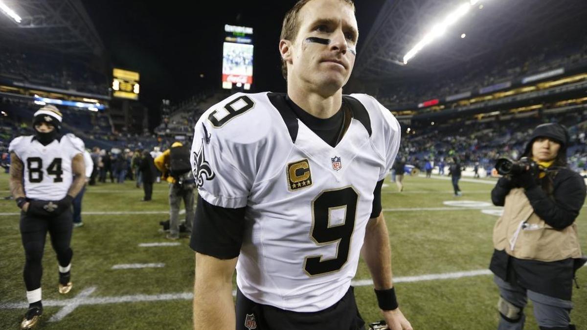 New Orleans Saints quarterback Drew Brees (9) walks off the field after a 34-7 loss to the Seattle Seahawks, in Seattle in 2013. Brees said in a press conference Sunday that he disagrees with President Donald Trump’s comments about NFL players who kneel during the National Anthem. He also said he doesn’t agree with the protest, either.