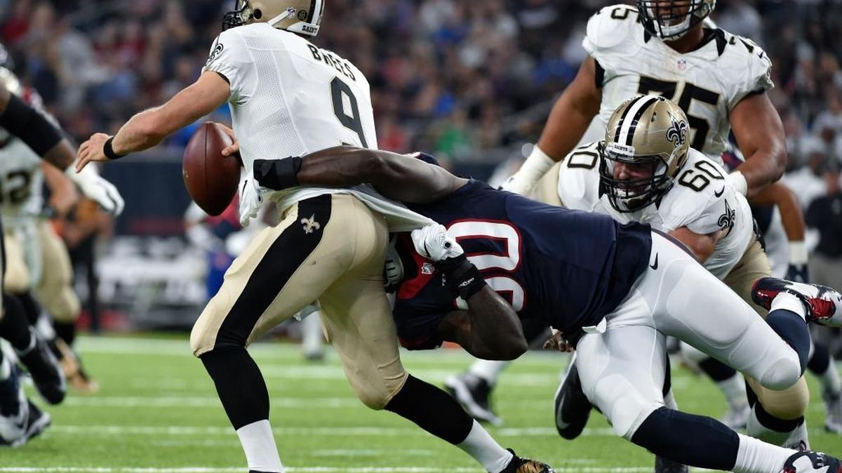 FILE - In this Aug. 20, 2016, file photo, Houston Texans outside linebacker Jadeveon Clowney (90) sacks New Orleans Saints quarterback Drew Brees (9) in the first half of an NFL preseason football game in Houston. In three preseason losses this summer, New Orleans hasn’t demonstrated that its offensive line can consistently protect 37-year-old star QB Drew Brees.