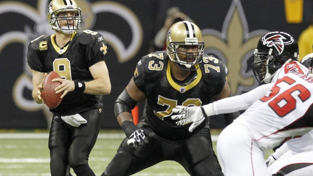 Jahri Evans blocks for Drew Brees during game against Atlanta. Evans was resigned by the Saints.