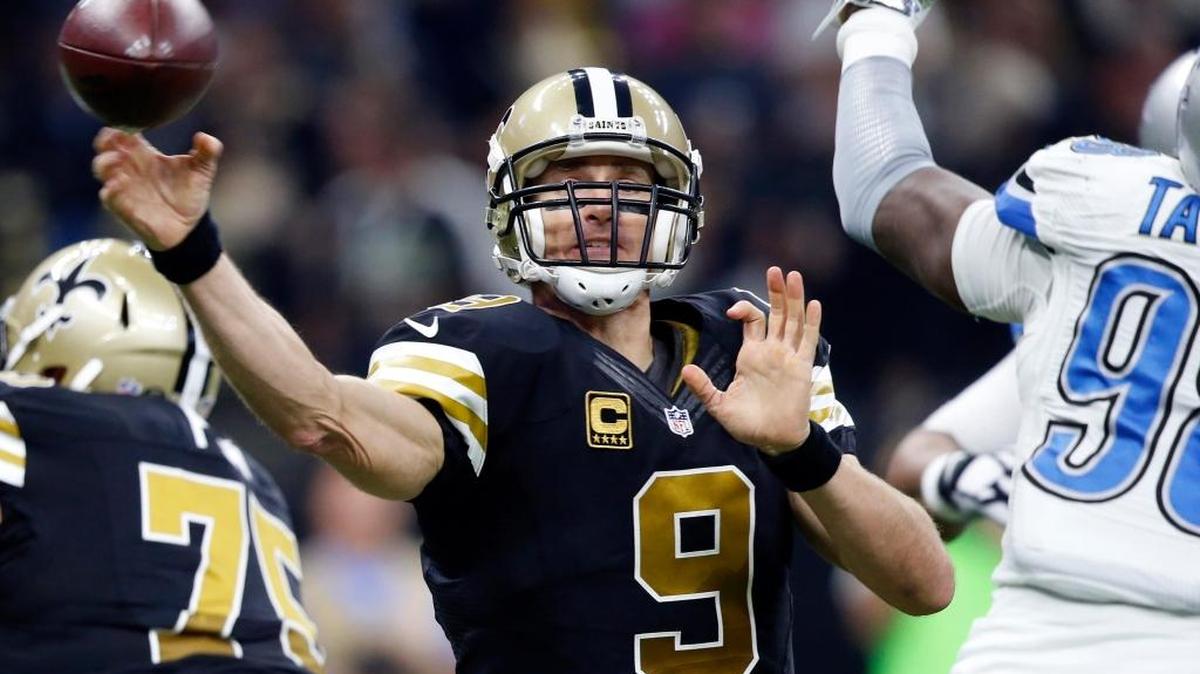 New Orleans Saints quarterback Drew Brees (9) passes under pressure from Detroit Lions defensive end Devin Taylor. The Saints Play the Arizona Cardinals on Sunday.