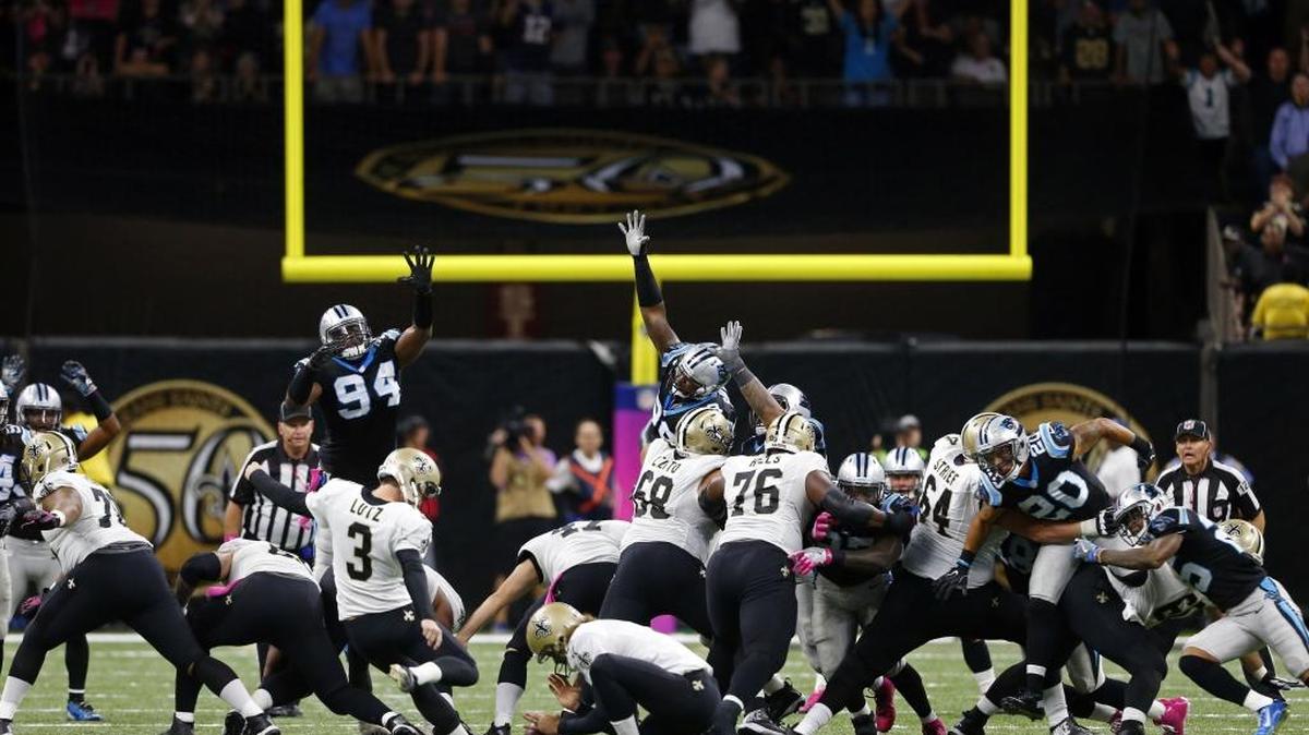 New Orleans Saints kicker Wil Lutz (3) kicks the game winning field goal against the Carolina Panthers.