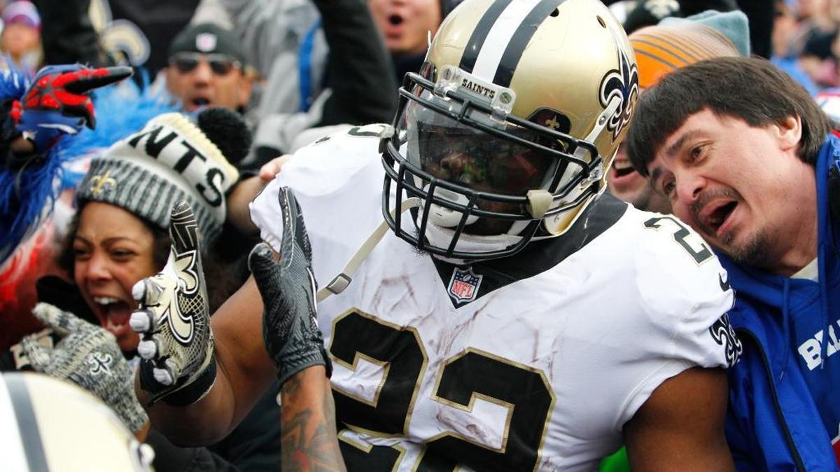 New Orleans Saints running back Mark Ingram (22) celebrates with fans and teammates after scoring a touchdown against the Buffalo Bills Sunday.