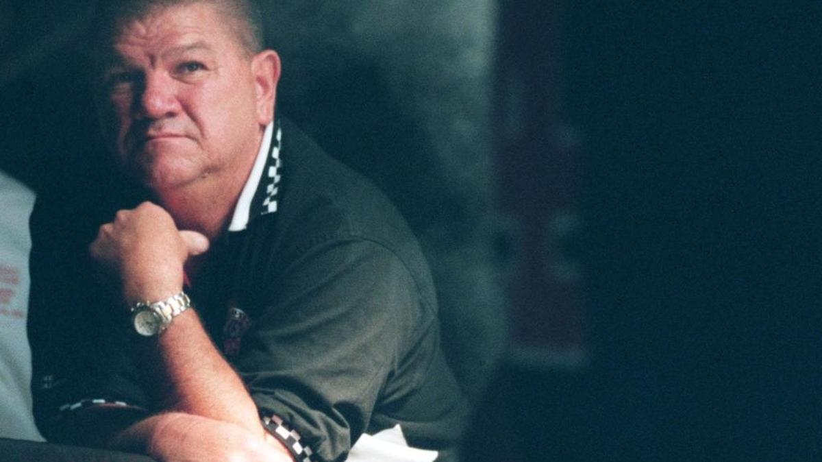Mississippi Fire Dogs coach Irvin Favre watches as the players are introduced before the start of a game in 2000.