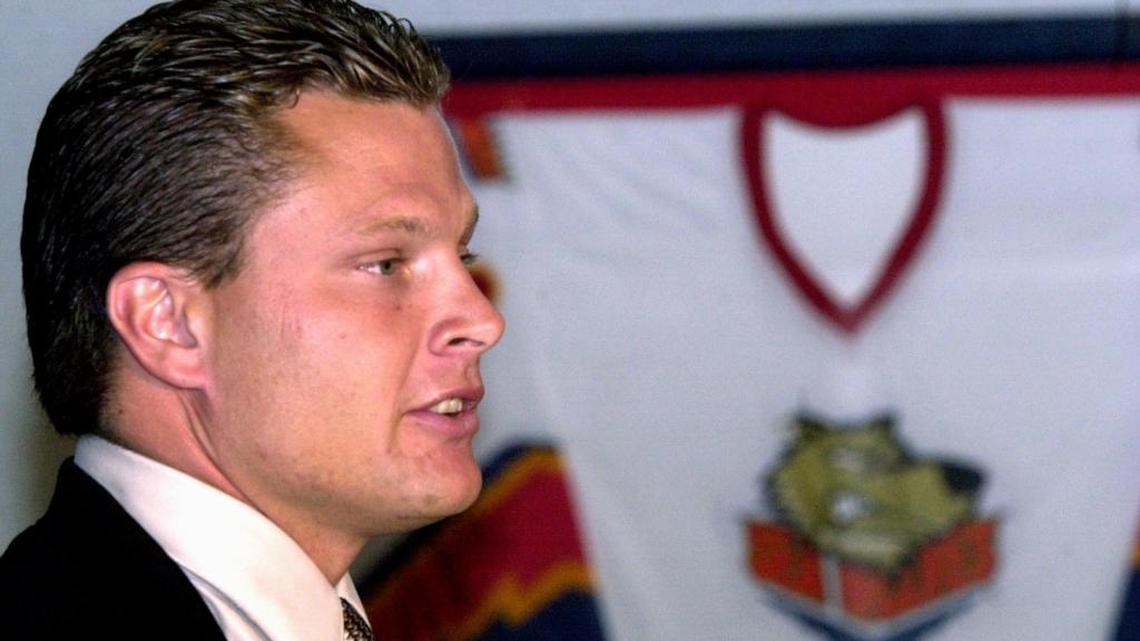 Bob Woods skates back behind NHL bench