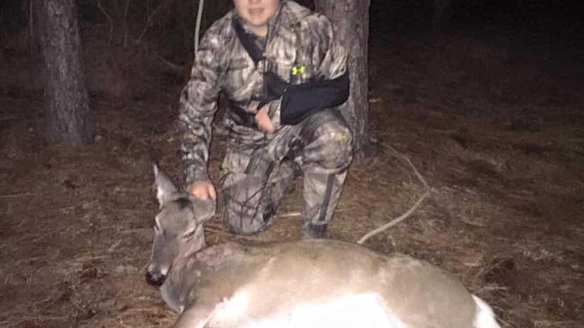 Long Beach’s Brody Blaker shows off a deer he recently harvested.