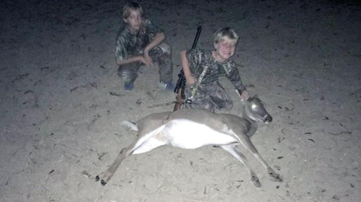 Brodie Hignight, 8, shows off his first deer, which he killed Nov. 7. With him is big brother Braxton, 11.