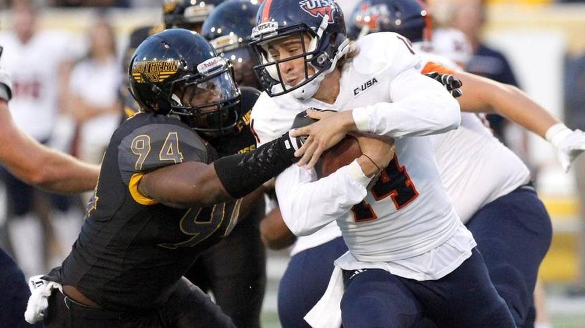 Southern Miss defensive lineman Dylan Bradley grabs hold of Texas-San Antonio quarterback Dalton Sturm on Oct. 17, 2015, in Hattiesburg.