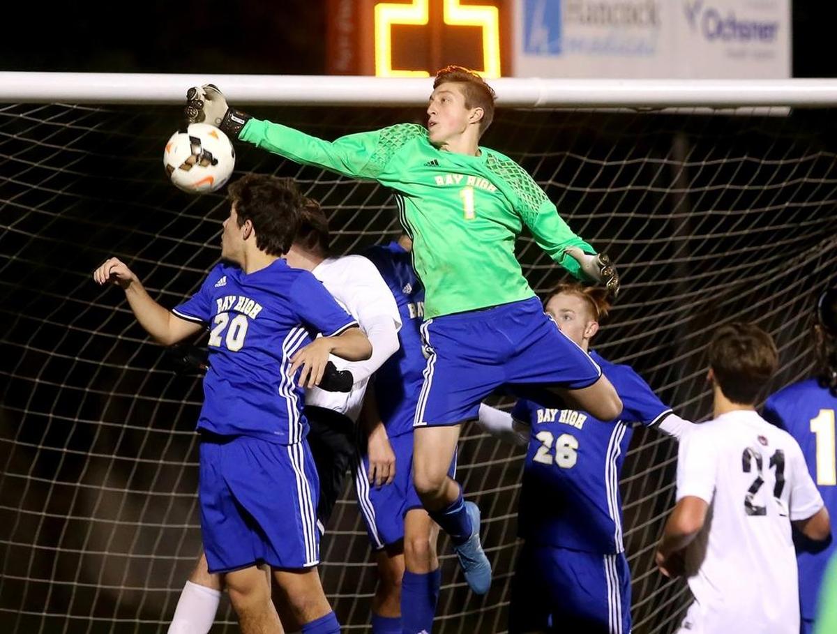 Bay High goalie John Bowman knocks the ball away from the net while competing against St. Stanislaus in the South State playoffs on Jan. 31. Photographer’s comments: This was a great save by John Bowman who made a great shot.