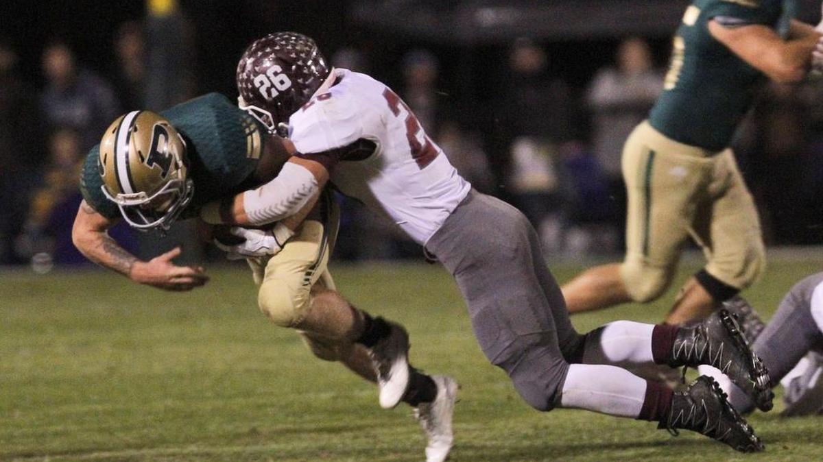 East Central safety Andrew Seward tackles Poplarville running back Cory Knight during the first quarter of their 4A South State championship game at Poplarville High School Stadium on Nov. 24, 2017.