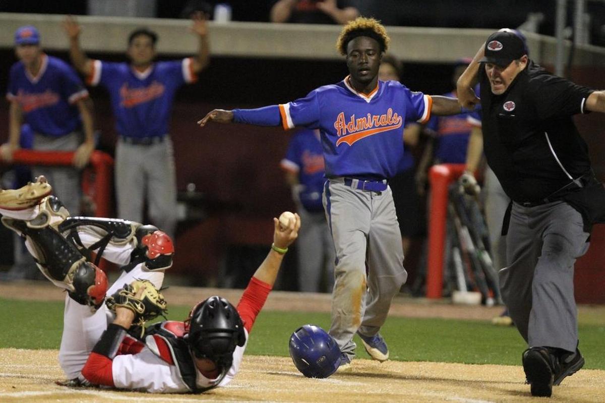 Gulfport’s Larazzo Shugart watches as the umpire calls him out following a tag by Biloxi catcher Tucker Thomas during the third inning of their game at Biloxi on March 28. Photographer’s comment: I love the way this photo tells the whole story and has so many layers in it. The body language of the three says it all.