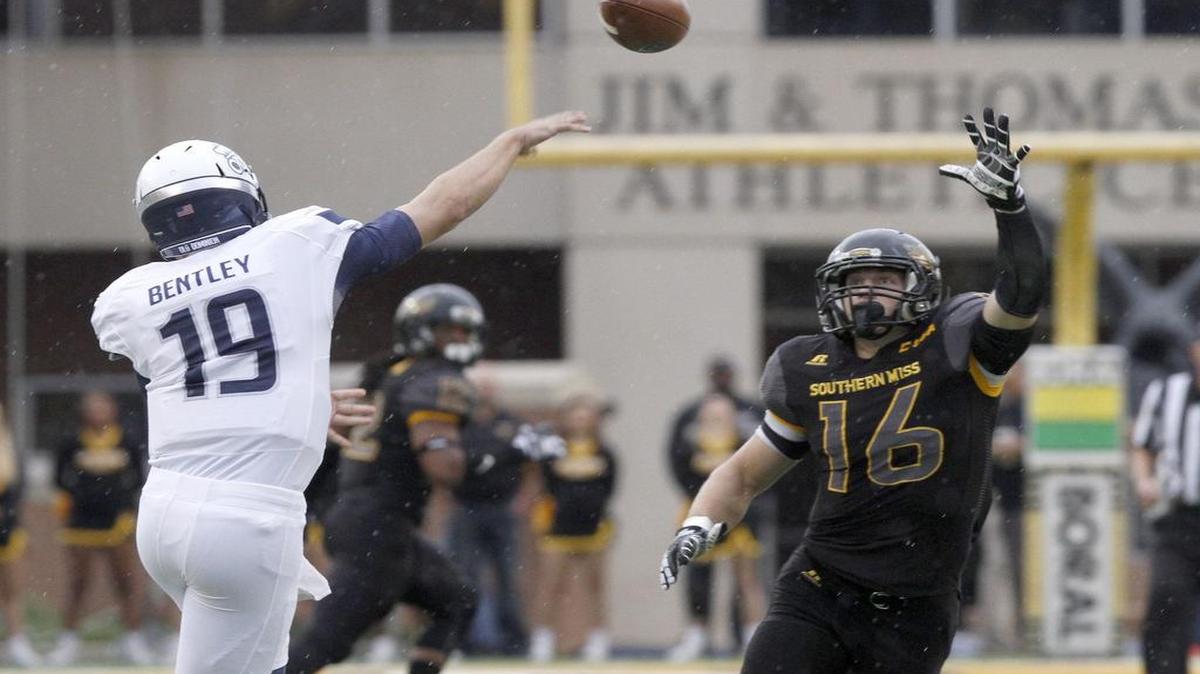 Southern Miss linebacker Elijah Parker tries to block the pass of Old Dominion quarterback Shuler Bentley on Nov. 21, 2015 in Hattiesburg. Both USM and ODU could be candidates for the American Athletic Conference if it needs to bolster its membership.