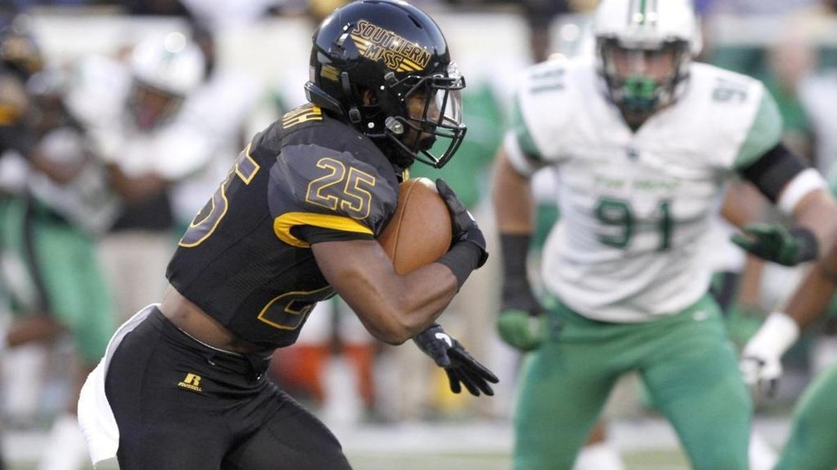 Southern Miss running back Ito Smith rushes for a first down against Marshall on Oct. 29, 2016, at Roberts Stadium in Hattiesburg.