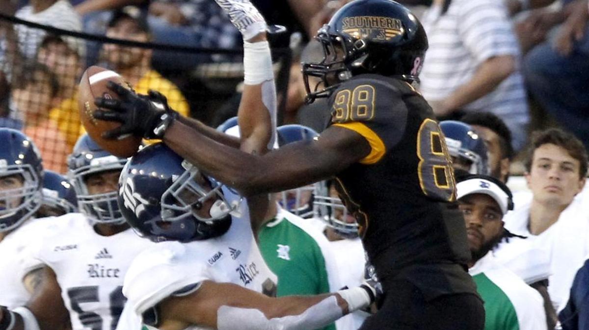 Southern Miss receiver Isaiah Jones tries to catch a pass off the helmet of Rice's V. J. Banks on Oct. 1 in Hattiesburg.